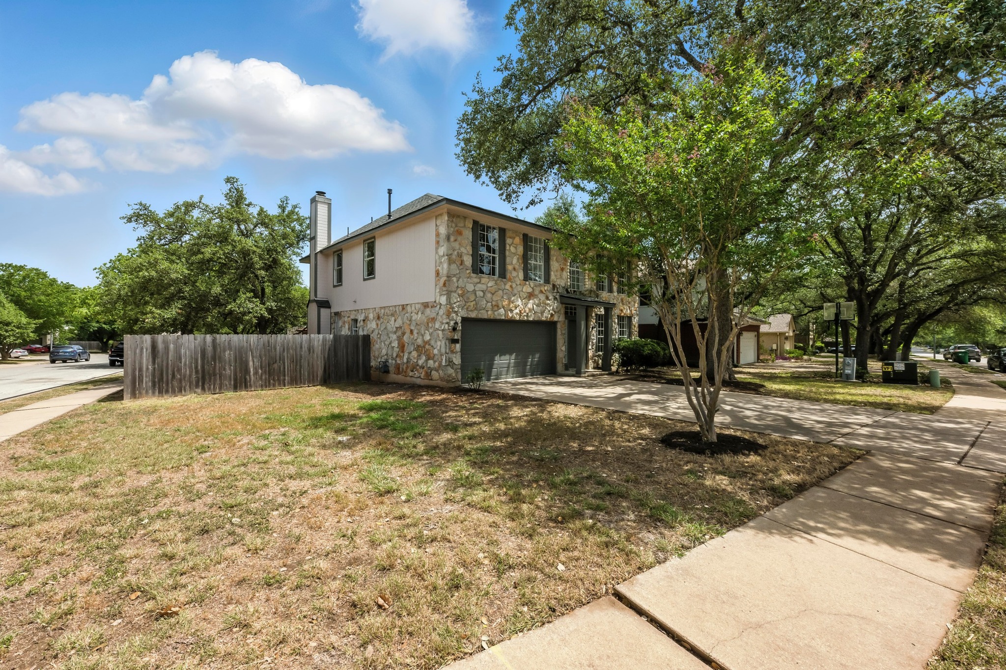 2113 Lobelia Drive Cedar Park, TX 78613 - Photo 3 of 38 a front view of a house with a yard and large tree