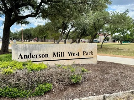 a view of a park with swings and slides
