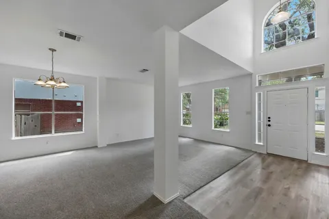 a view of livingroom with hardwood floor and hallway