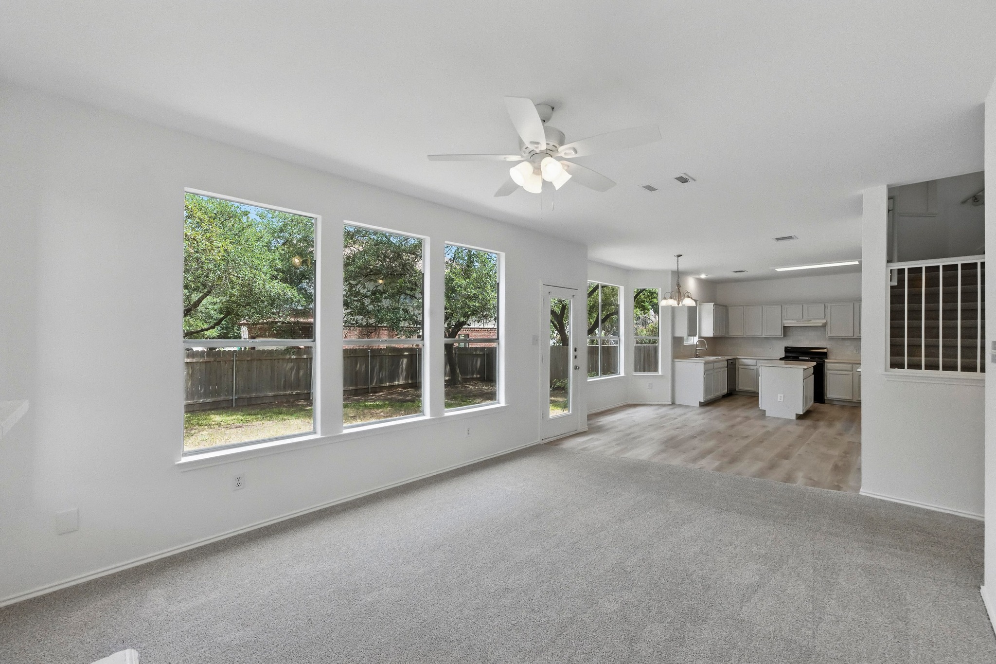 2113 Lobelia Drive Cedar Park, TX 78613 - Photo 10 of 38 a view of an empty room with a window and kitchen view