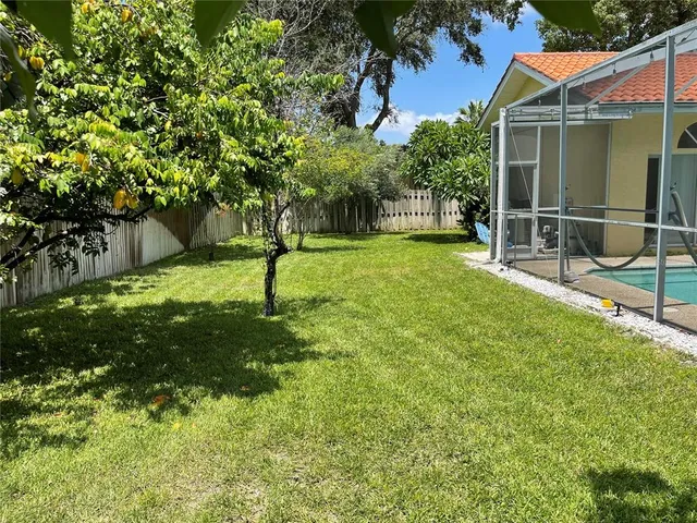 a view of backyard with green space
