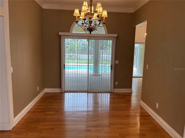 a view of entryway with wooden floor