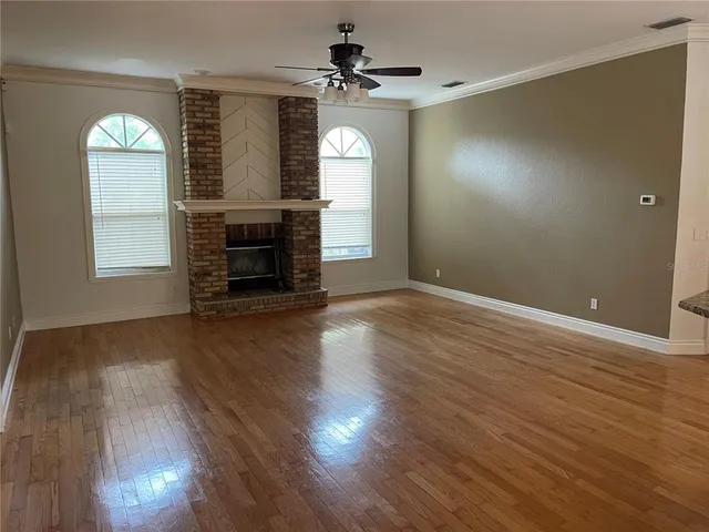 a backyard of a house with lots of green space and plants