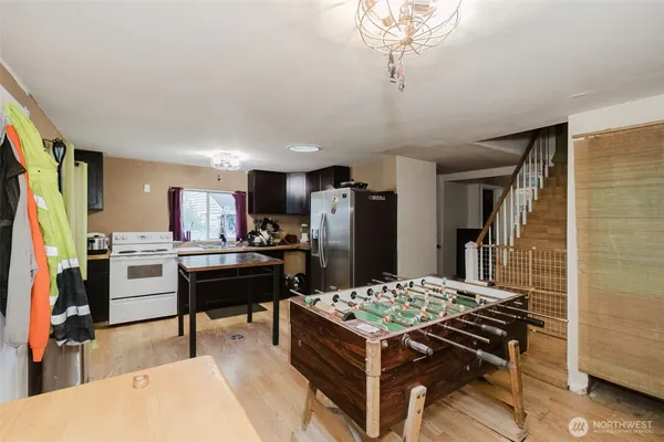 a kitchen with a refrigerator and a stove