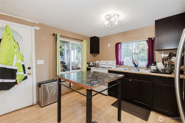 a view of living room with granite countertop furniture and a flat screen tv