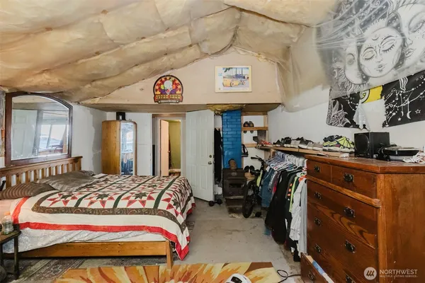 a bedroom with a bed and closet