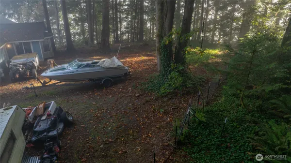 a backyard of a house with table and chairs