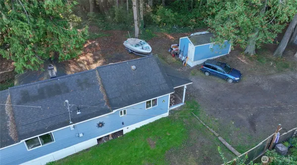 an aerial view of a house with a yard