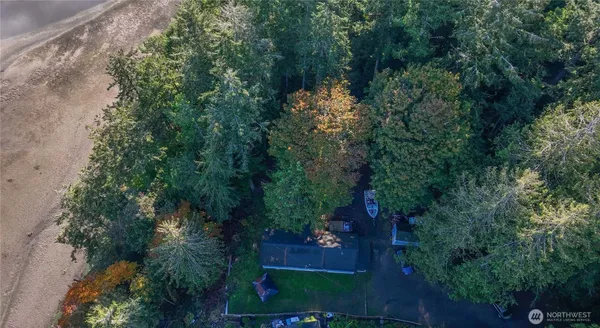 an aerial view of a house with yard and outdoor seating