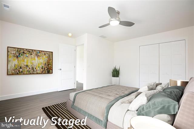 2 5th Street Del Haven, NJ 08251 - Photo 13 of 24 a bedroom with a bed and a painting on the wall