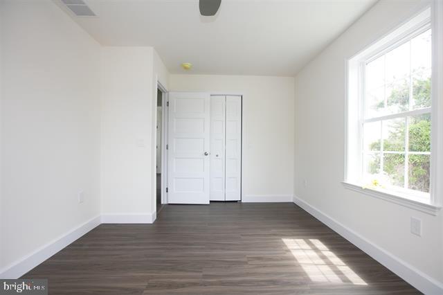 2 5th Street Del Haven, NJ 08251 - Photo 20 of 24 an empty room with wooden floor and windows