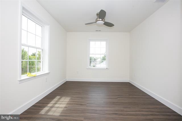 2 5th Street Del Haven, NJ 08251 - Photo 21 of 24 wooden floor in an empty room with a window