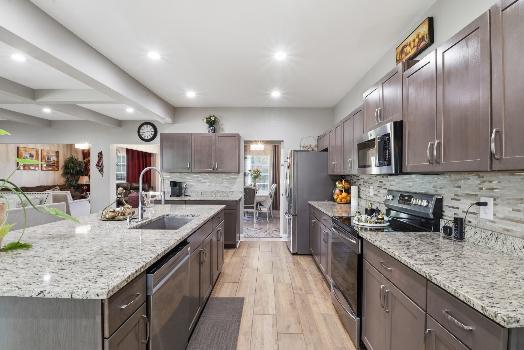 126 Savannah Ridge Murfreesboro, TN 37127 - Photo 14 of 50 a large kitchen with stainless steel appliances granite countertop plenty wooden cabinets counter space a sink and a wooden floor