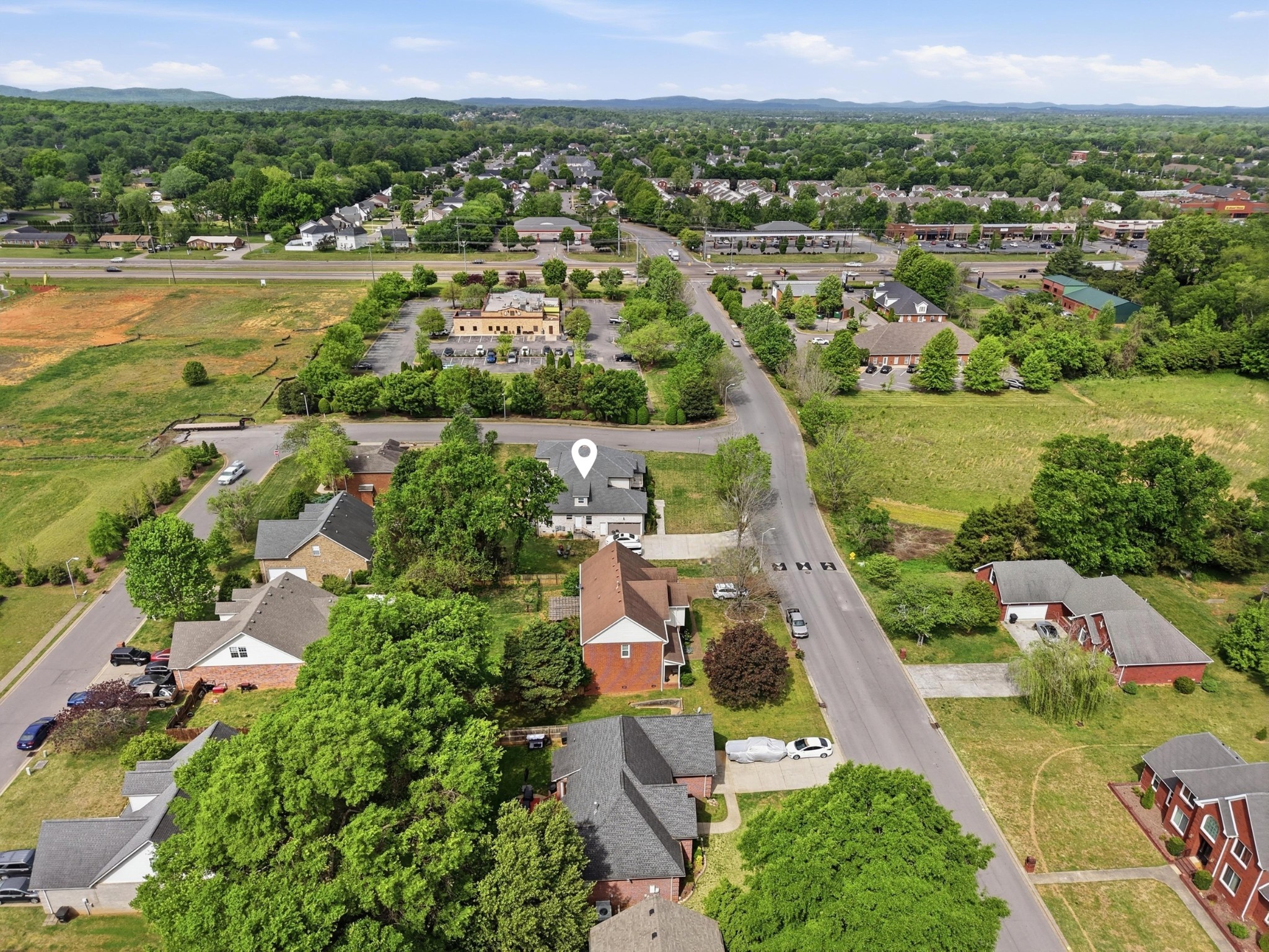 126 Savannah Ridge Murfreesboro, TN 37127 - Photo 49 of 50 an aerial view of a city with lots of residential buildings and mountain view in back