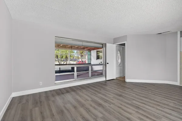 a kitchen with stainless steel appliances granite countertop a stove microwave and cabinets