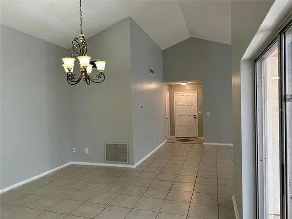 a view of a chandelier in big room and chandelier