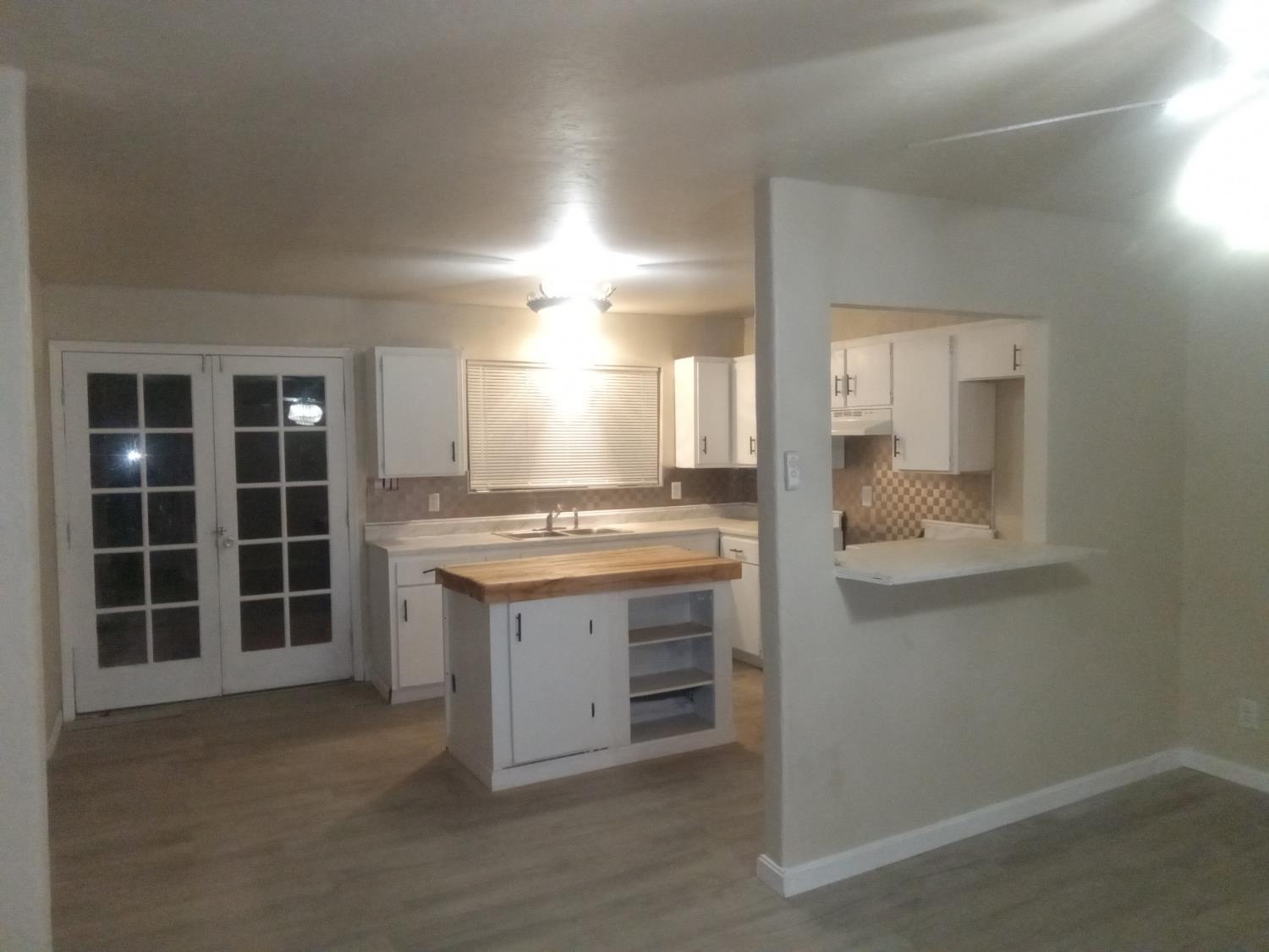 602 South Spruce Road Exeter, CA 93221 - Photo 18 of 28 an empty room with a cabinet and mirrors