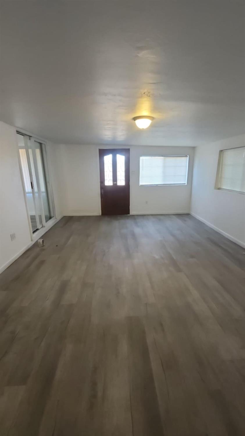 602 South Spruce Road Exeter, CA 93221 - Photo 20 of 28 a view of an empty room with a window