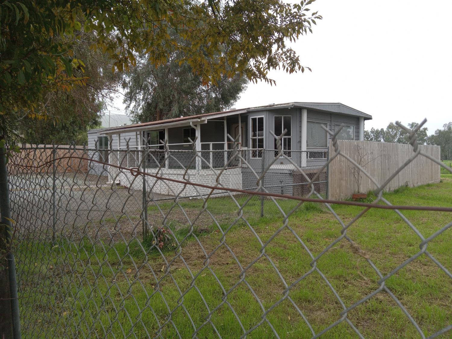 602 South Spruce Road Exeter, CA 93221 - Photo 6 of 28 a backyard of a house with table and chairs