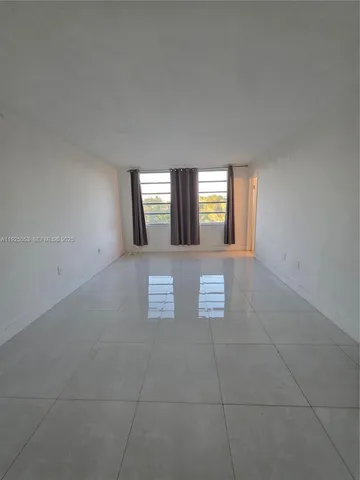 a view of a hallway with windows