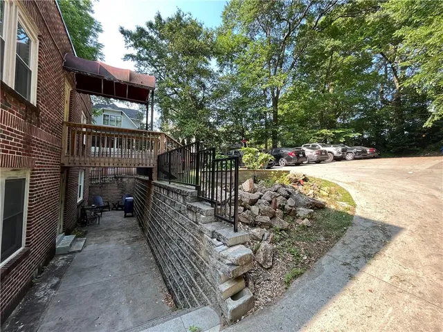 a view of a pathway with a patio