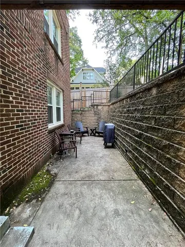 a backyard of a house with outdoor seating