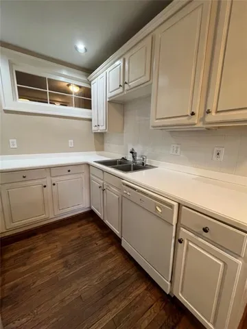 a kitchen with stainless steel appliances granite countertop a sink and cabinets