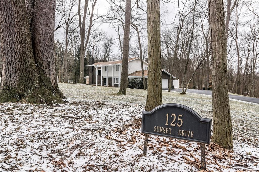 125 Sunset Drive Canonsburg, PA 15317 - Photo 25 of 25 a sign that is sitting on a brick wall