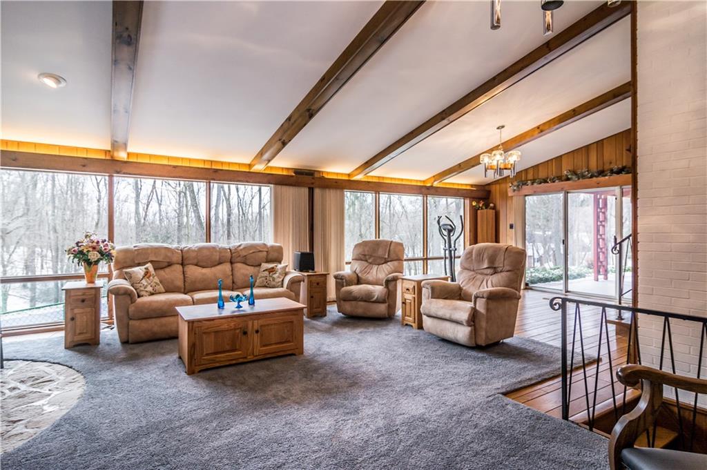 125 Sunset Drive Canonsburg, PA 15317 - Photo 7 of 25 a living room with furniture a ceiling fan and a window