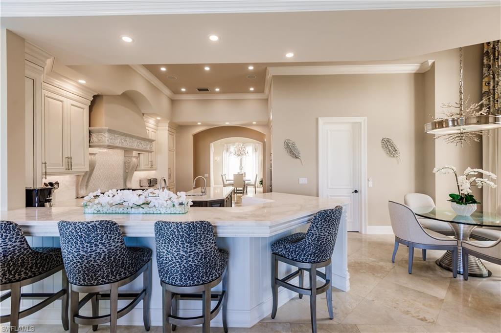 2450 Tarpon Road Naples, FL 34102 - Photo 16 of 26 a dining room with furniture and window