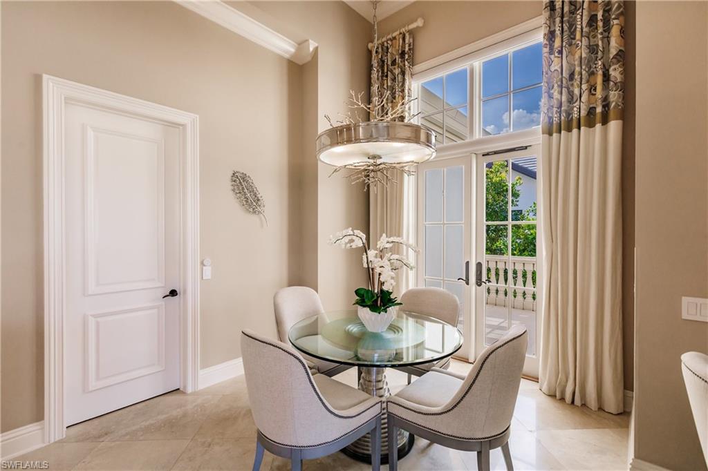 2450 Tarpon Road Naples, FL 34102 - Photo 17 of 26 a view of a dining room with furniture and window