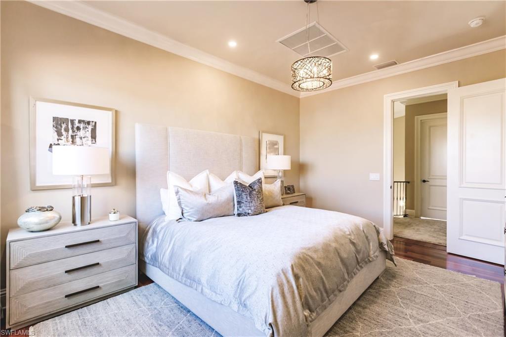 2450 Tarpon Road Naples, FL 34102 - Photo 24 of 26 a bedroom with bed and a window