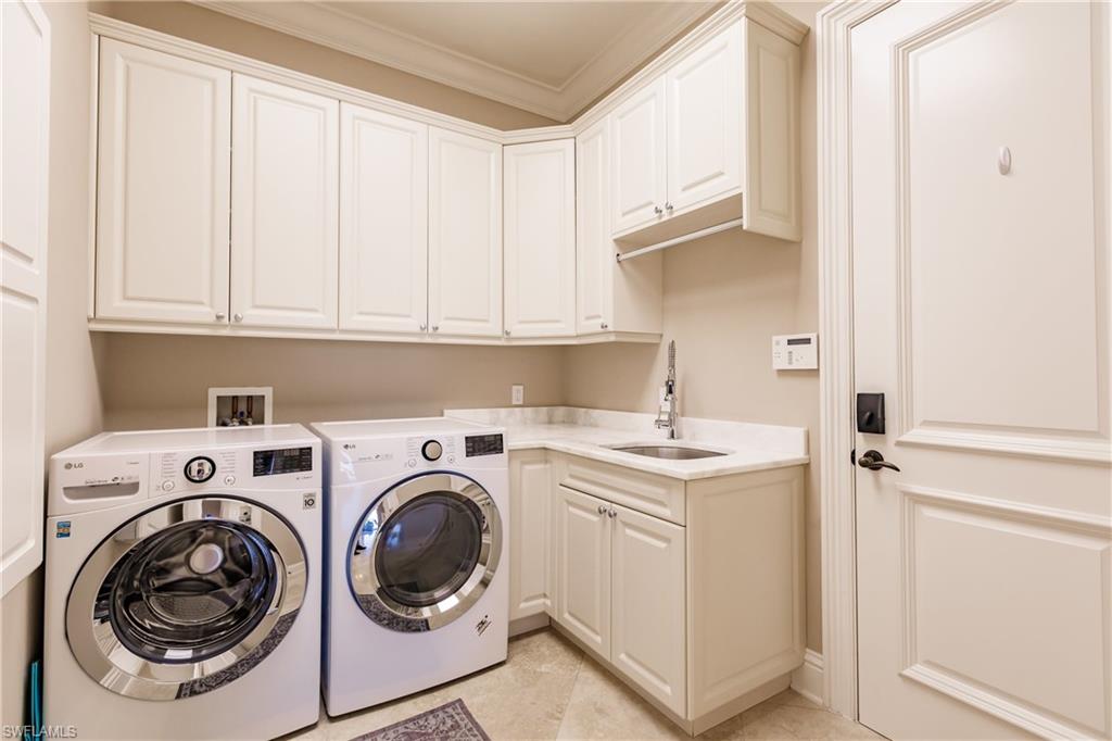 2450 Tarpon Road Naples, FL 34102 - Photo 26 of 26 a utility room with sink dryer and washer