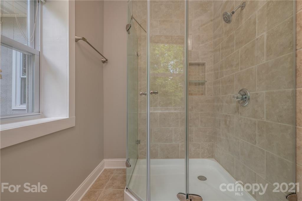 196 Caledonia Road Landrum, SC 29356 - Photo 12 of 26 a bathroom with a shower