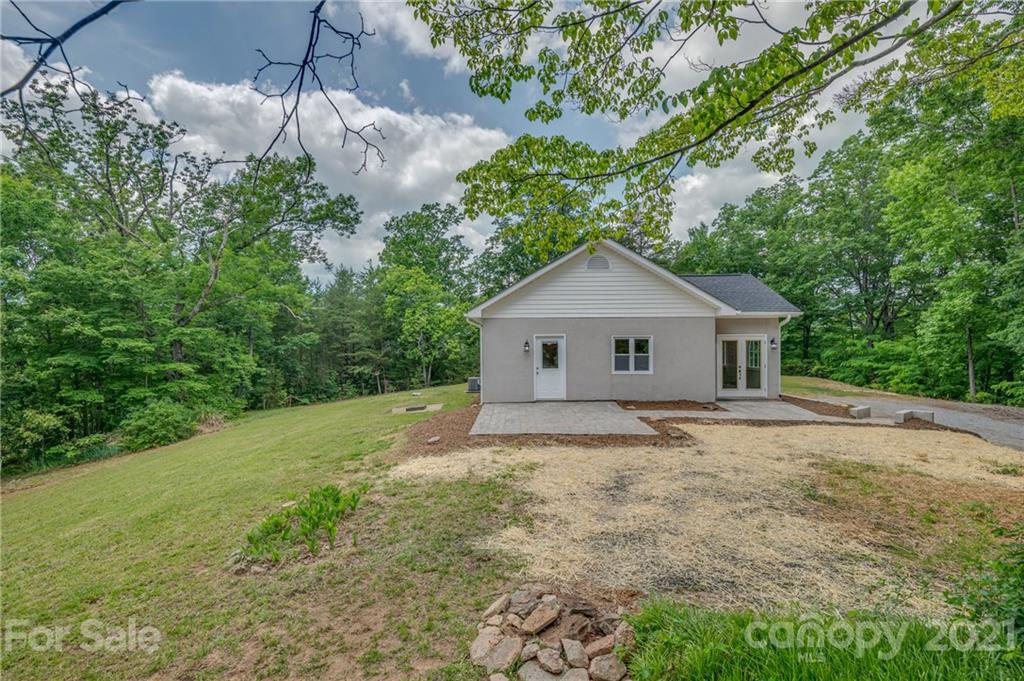 196 Caledonia Road Landrum, SC 29356 - Photo 20 of 26 a house with a tree in front of it