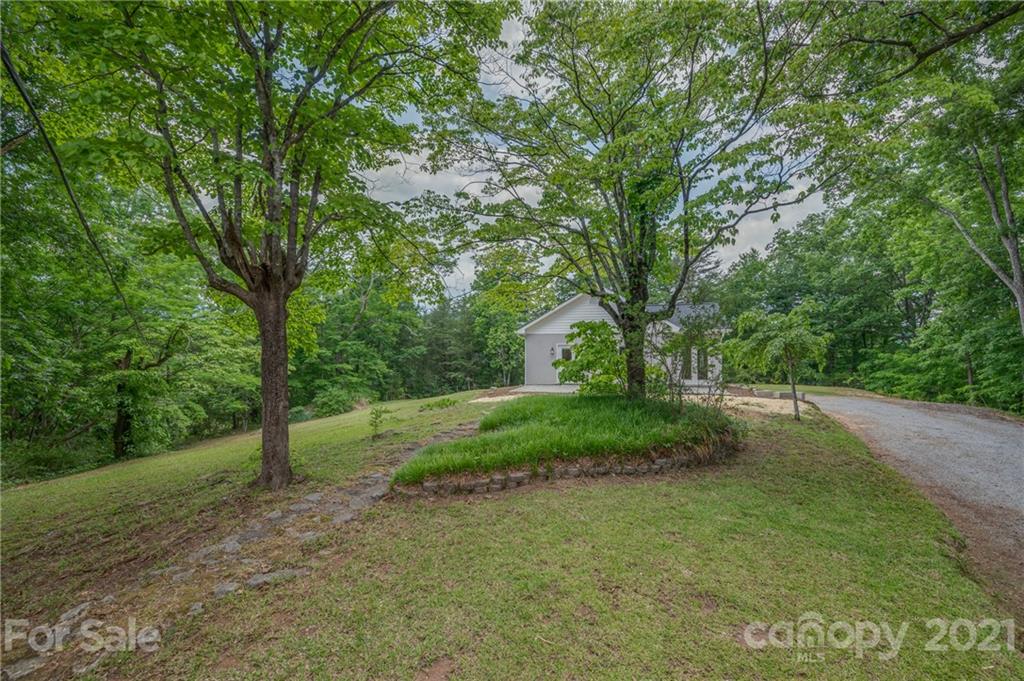 196 Caledonia Road Landrum, SC 29356 - Photo 23 of 26 a view of a field with large trees
