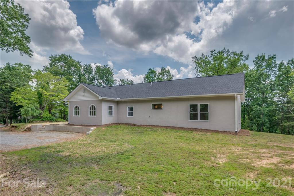 196 Caledonia Road Landrum, SC 29356 - Photo 25 of 26 a view of a house with a yard