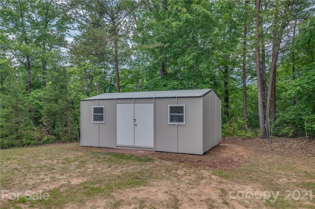 196 Caledonia Road Landrum, SC 29356 - Photo 26 of 26 a view of a house with a backyard