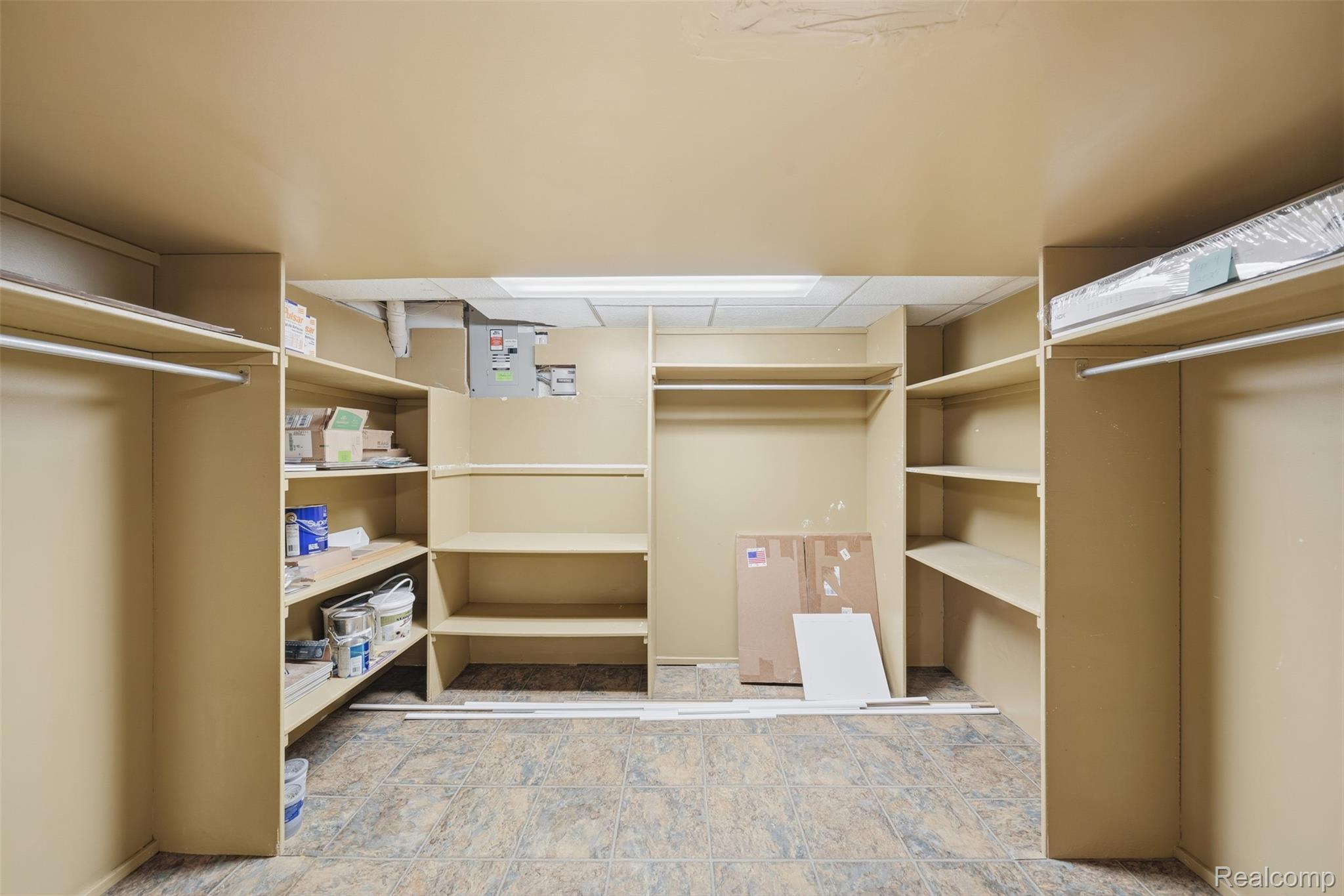 1087 Collingwood Drive Rochester, MI 48307 - Photo 52 of 56 Built-in shelving, hanging rods, and patterned flooring
