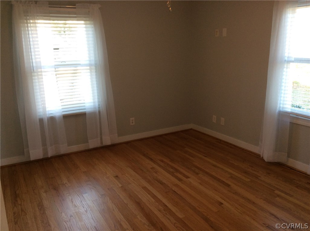 700 Courthouse Road North Chesterfield, VA 23236 - Photo 14 of 47 an empty room with wooden floor and windows