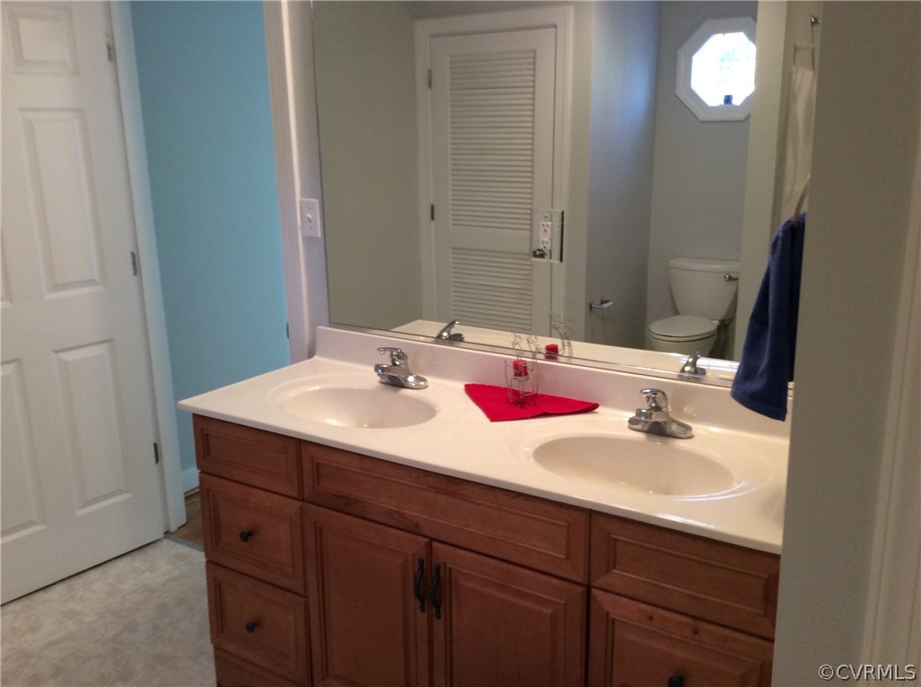 700 Courthouse Road North Chesterfield, VA 23236 - Photo 20 of 47 a bathroom with a sink and a mirror