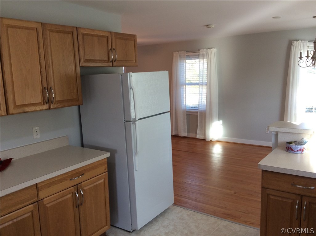 700 Courthouse Road North Chesterfield, VA 23236 - Photo 7 of 47 a kitchen with a refrigerator and a stove top oven