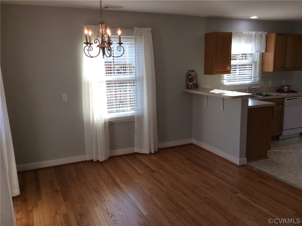 700 Courthouse Road North Chesterfield, VA 23236 - Photo 9 of 47 a kitchen with granite countertop wooden floors a sink and a window