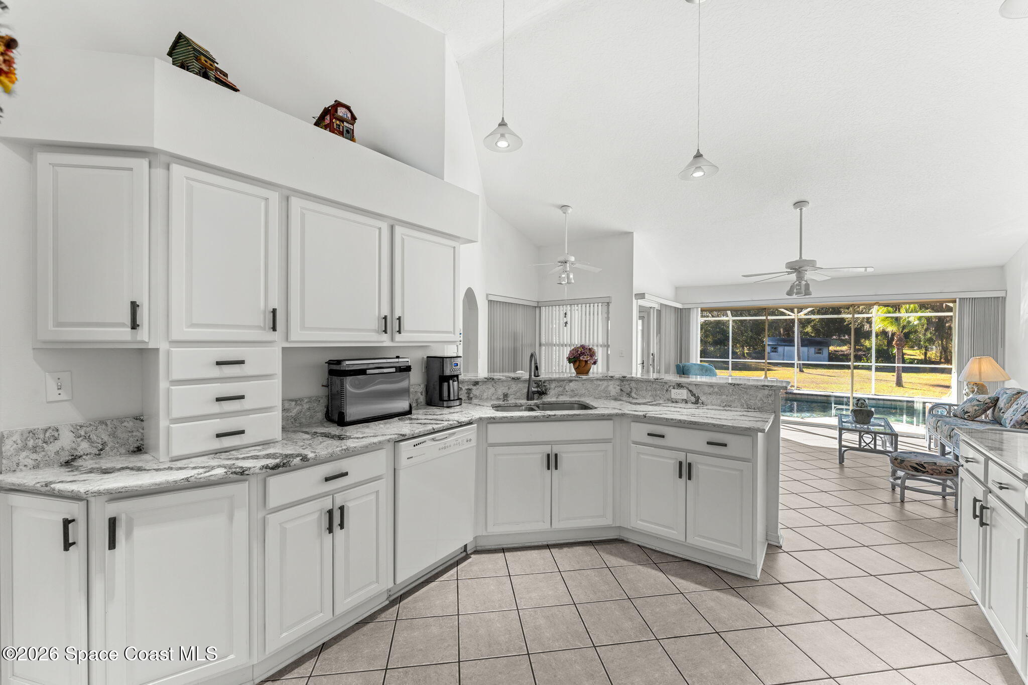 4250 Pine Street Cocoa, FL 32926 - Photo 12 of 30 a kitchen with granite countertop a sink and cabinets