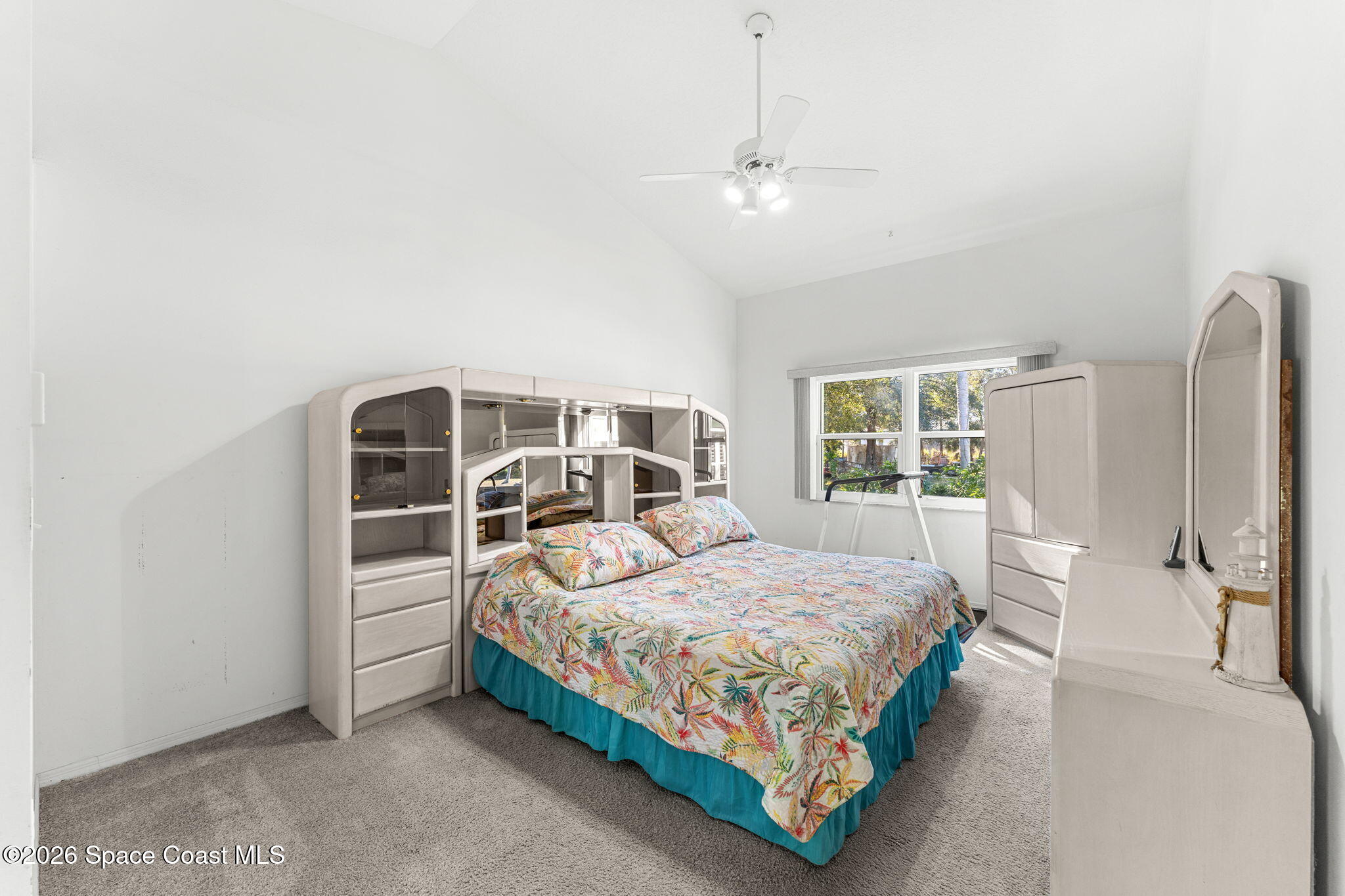 4250 Pine Street Cocoa, FL 32926 - Photo 14 of 30 a bedroom with a bed a window and walk in closet