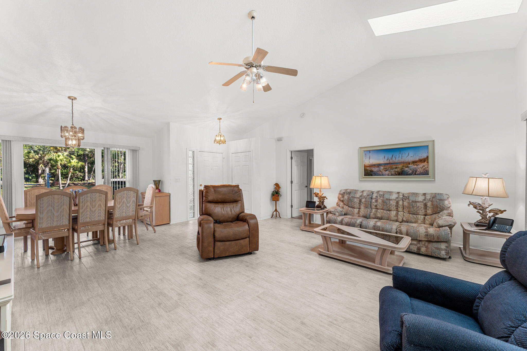 4250 Pine Street Cocoa, FL 32926 - Photo 3 of 30 a living room with furniture and a chandelier
