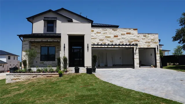 a view of a house with a yard and porch