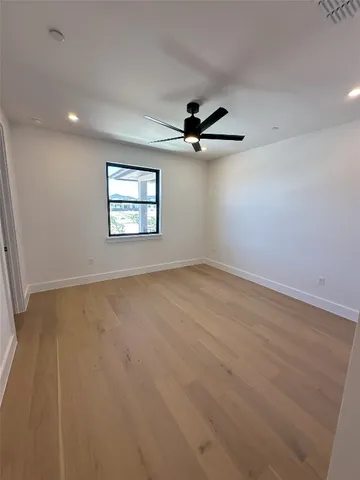 a bathroom with a double vanity sink mirror and toilet