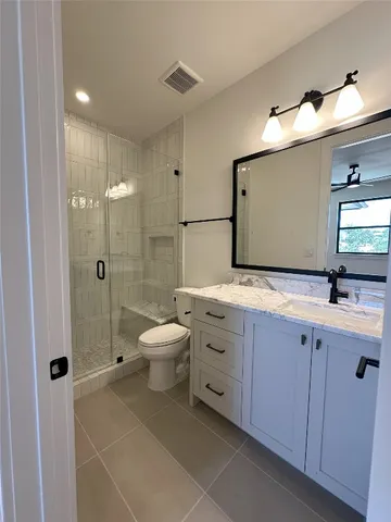 a bathroom with a bathtub and shower
