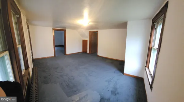 an empty room with windows